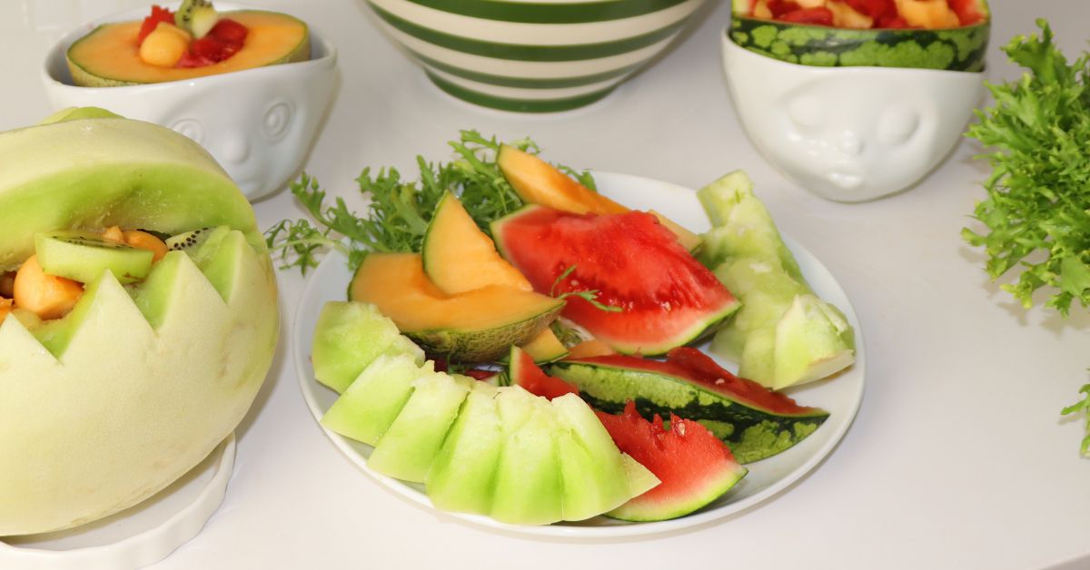 Honey dew Fruit basket filled with bite sized variety of fruit. Cantelope bowl made from scooped out 1/2 watermelon Plus a Fruit plate