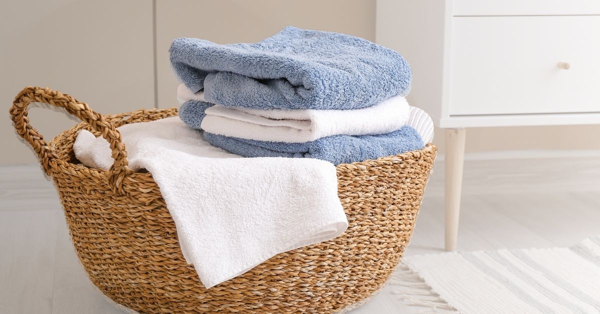 Non-toxic laundy detergent. Clean clothing in a wicker basket