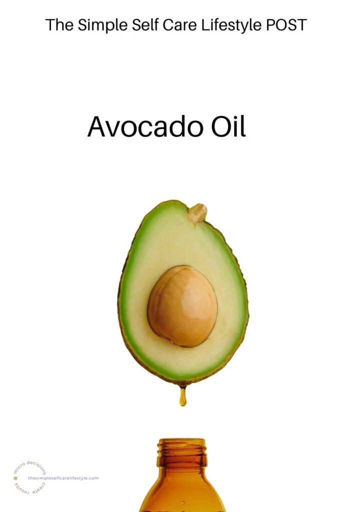 An avocado split in half we see the pit and surrounding meat of the avocado and there is a drip of oil down to the mouth of a bottle. The word Avocado is above the avaocado and at the top the words The Simple Self Care Lifestyle