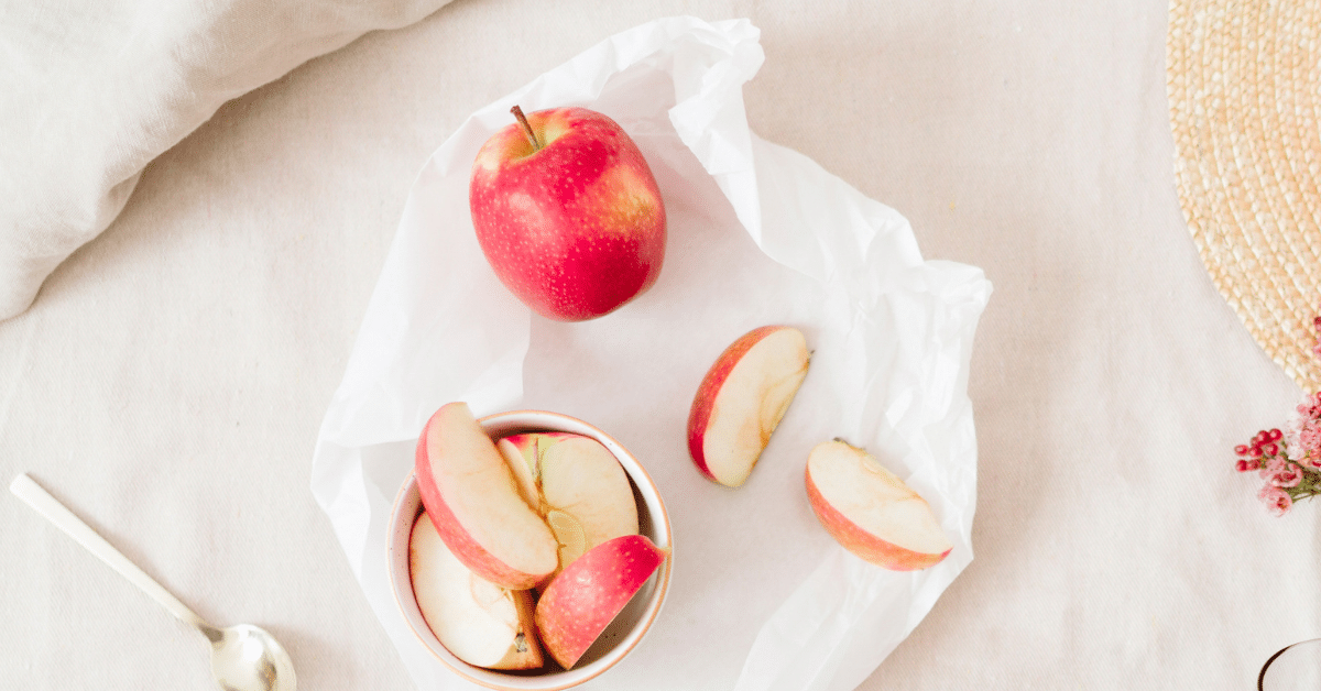 A whole apple and sliced